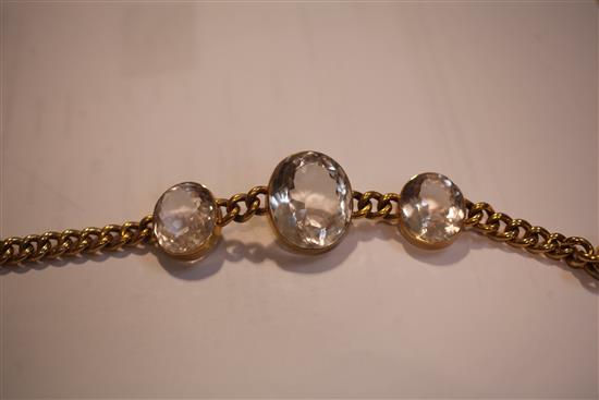 An early 20th century 15ct gold chain link bracelet set with three oval facet cut rock crystals, in fitted C. Packer & Co box,